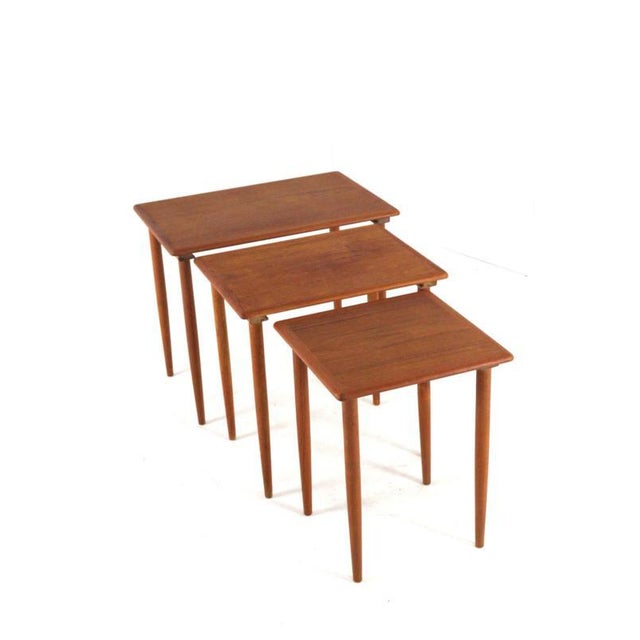 Three side tables that together form a set of "Nesting Tables." With their minimalist design, they are a feast for the...