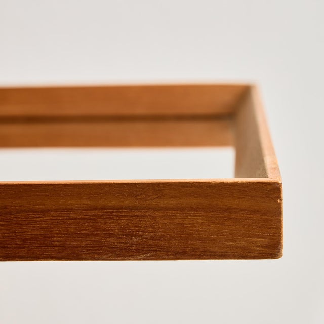 Classic-lined longish teak framed mirror from the 1960s. with some surface scratches, stains and wear on the wooden and...