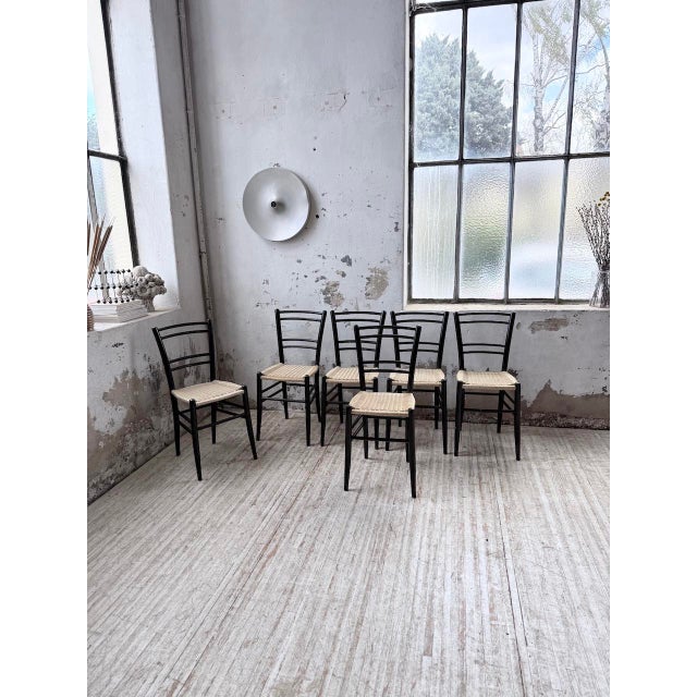 Set of 6 chairs inspired by Gio Ponti or Spinetto by Chiavari. Solid beechwood frame stained black with light woven rope...