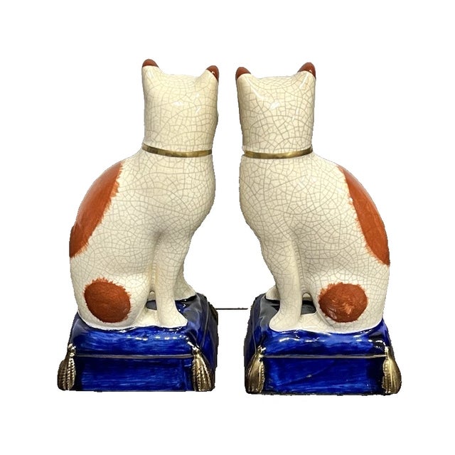 Charming vintage Fitz & Floyd Staffordshire-style cat figurine bookends, offered as a matching pair. These beautifully...