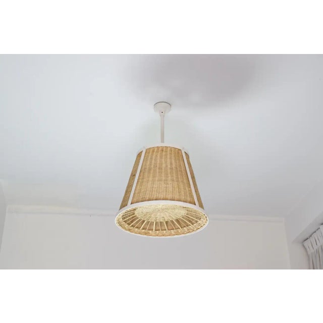 The Caeli-W contemporary handcrafted made-to-measure pendant light fixture features an expertly handcrafted white...