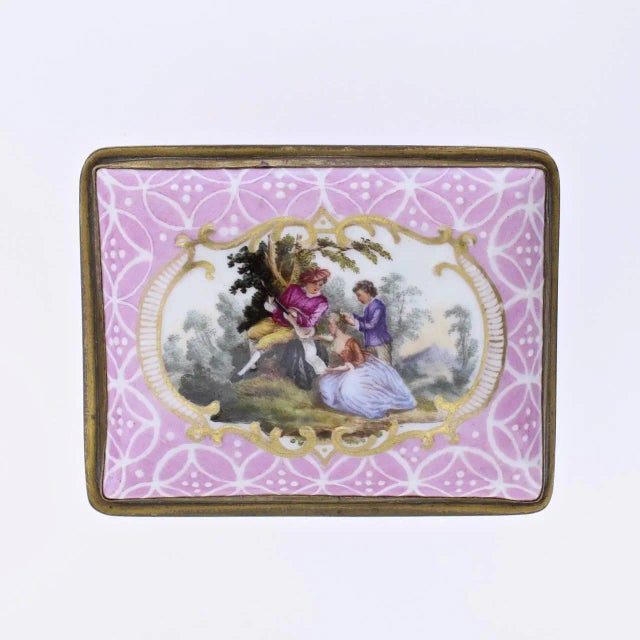 A fine antique English South Staffordshire or Battersea enamel table snuff box. With a pink ground and white enamel...