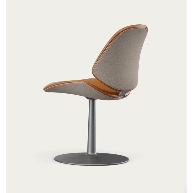 Salto and sigsgaard council family salon chair base: graphite, duo upholstery: front: nevada cognac + back: steelcut...