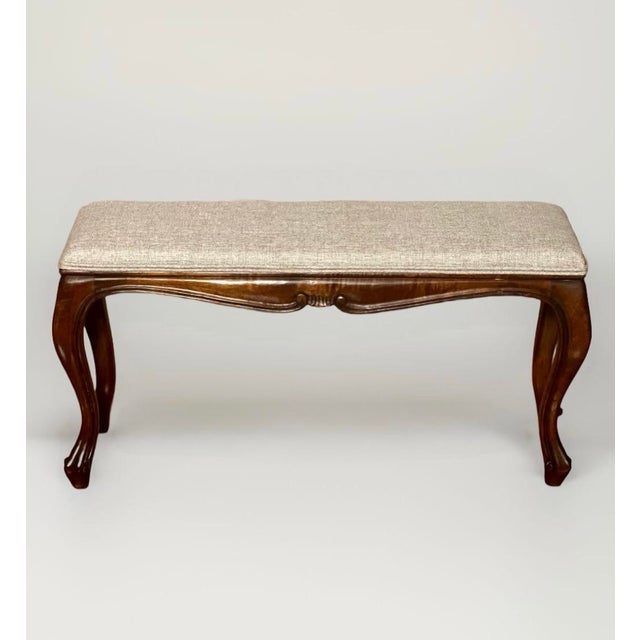 Fantastic, petite Louis XV style bench of figured walnut, newly reupholstered, made in Italy, circa 1920. Delicate, hand-...