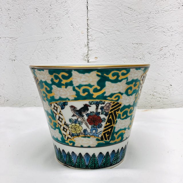 Lovely chinoiserie style cache pot in colors turquoise, black, yellow, black and blue with gold accents. Marked Norleans,...
