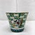 Lovely chinoiserie style cache pot in colors turquoise, black, yellow, black and blue with gold accents. Marked Norleans,...