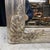 A French silver gilt mirror with a finely carved frame featuring stylized floral corner motifs and a soft silvered finish....