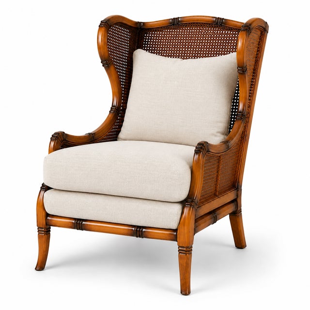 This elegant vintage lounge chair featuring faux bamboo wood frame and woven cane back, blending British Colonial and...