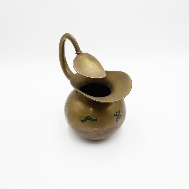Hand-forged mixed metal water jug, Los Castillo, Taxco, mid-20th century, water lily shaped ice rim, globular body...