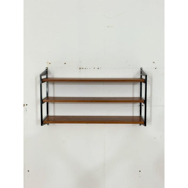 For sale is a compact String shelf in a timeless Scandinavian design. The shelf impresses with its simple lines,...