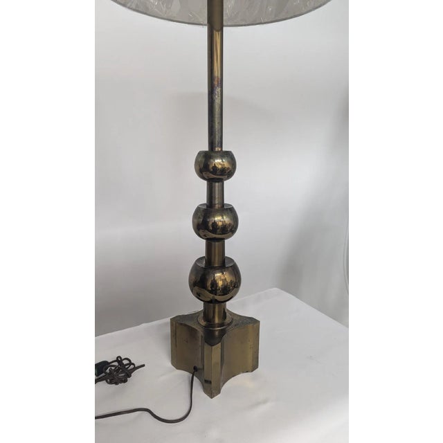 Antique Brass Finish Lamp Attributed to Tommi Parzinger Stiffel do not have any marc or label but the investigation give...