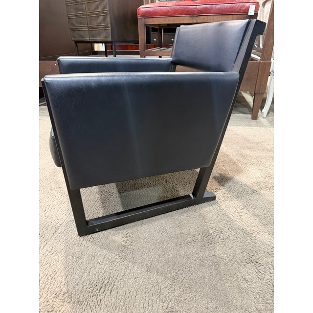 This Camerich Musa lounge chair is a refined example of contemporary design inspired by the clean architectural language...