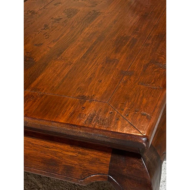 Rustic hewn solid mahogany wood table, gorgeous in its subtle curves, simple lines and hefty strong presence.