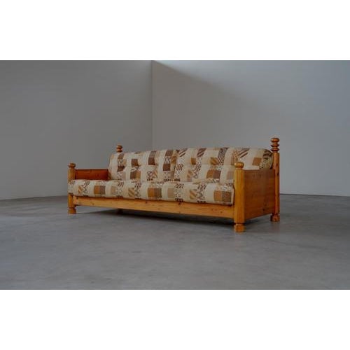 Pine sofa The sofa is in good condition with traces of usage normal to its age. The pillows are in their original upholstery.