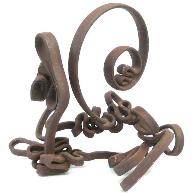 A wonderfully playful wrought-iron sculpture of a lively, looping and squiggling "ribbon." Great scale and form. Seemingly...