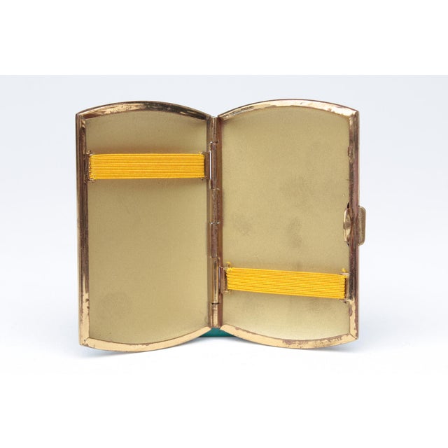 Small cigarette case, made in Germany in the 1930s. Metal with a coated finish. Suitable for cigarettes 6.5 cm in length....