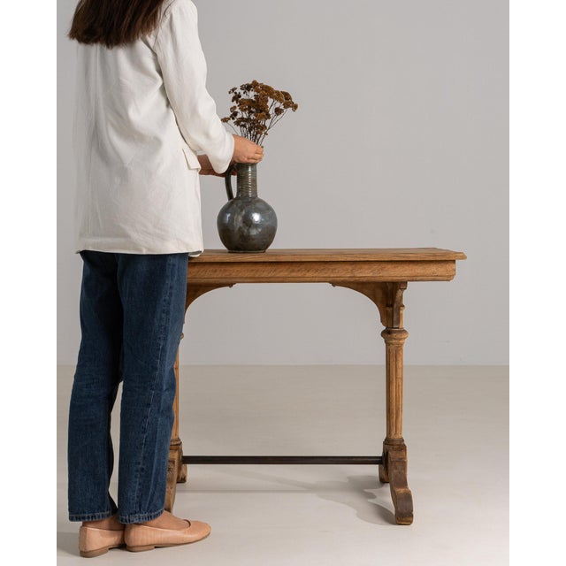 Carved oak console table in Weathered Honey Oak. Finished in weathered honey oak, this carved oak console table is...