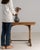 Carved oak console table in Weathered Honey Oak. Finished in weathered honey oak, this carved oak console table is...