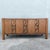 This mid century Brutalist credenza by United Furniture Corporation balances sculptural artistry with refined...