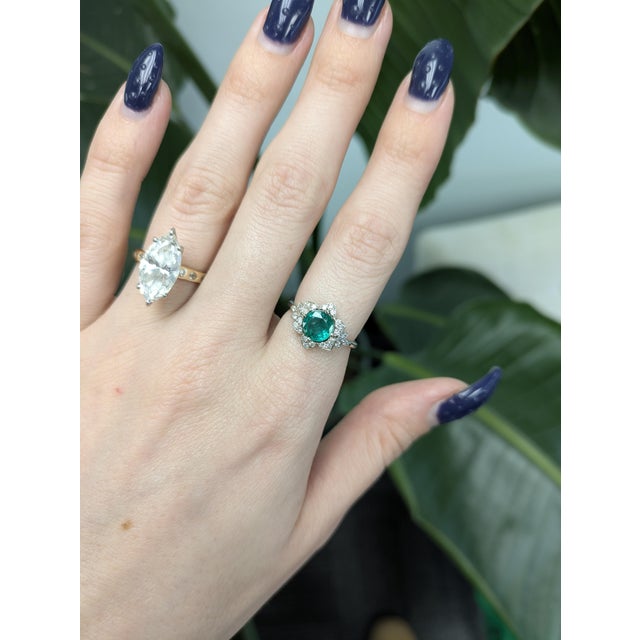 1ct Colombian emerald ring with natural diamond accents, set in solid 14k gold. Features a vivid 7mm emerald centerpiece...