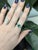 1ct Colombian emerald ring with natural diamond accents, set in solid 14k gold. Features a vivid 7mm emerald centerpiece...