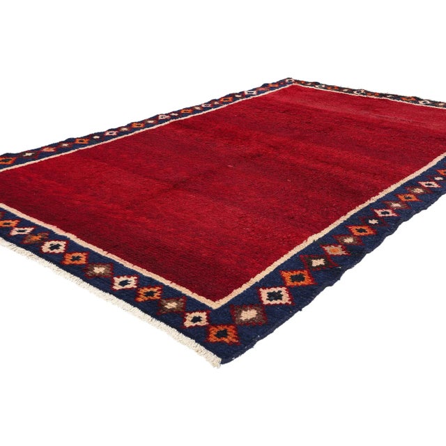 78883 Vintage Persian Lori Solid Red Field Rug with Geometric Border, 05'03 x 08'05. Persian Lori rugs, crafted by the...