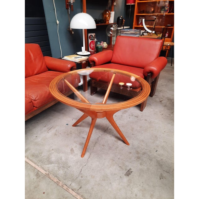 Vintage Round Wood Coffee Tabe with Spider Legs by Paolo Buffa for Brugnoli A stunning spider-leg coffee table designed by...