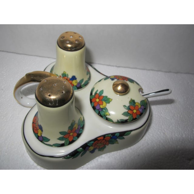 Beautiful gold leaf on top of salt and pepper shakers and finial on mustard pot lid. This lovely, complete set will...