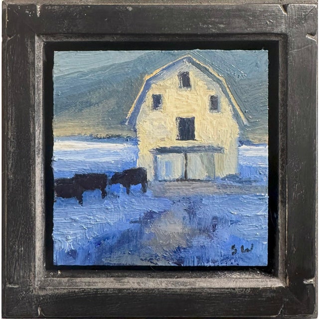 Feeding Time depicts a serene rural scene, showcasing a barn set against a moody twilight sky. The cool blue tones...