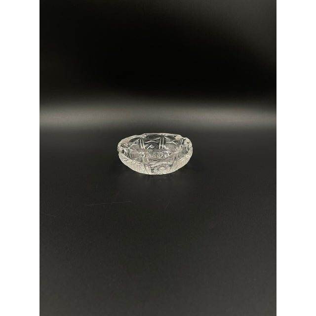 An ashtray from the communist era, made of high-quality crystal glass. The ashtray is decorated with a rich, hand-cut...