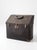 This vintage industrial travel case features a distinctive slant-top form with riveted metal construction, reinforced...