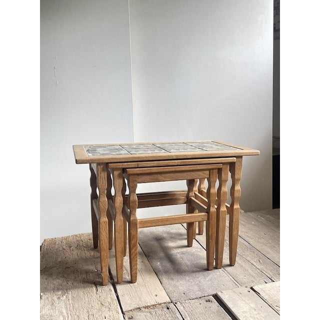 Elegant set of three nesting tables designed by Henning Kjærnulf and produced in Denmark by EG Kvalitetsmøbel during the...
