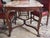 Neo-Rococo table decorated with hand carving with floral motifs. The thick and very heavy marble top is profiled with a...