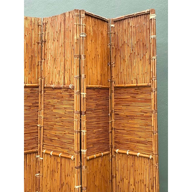 This vintage four-panel folding screen is a stunning example of Boho Chic design, offering a rich, organic texture that...