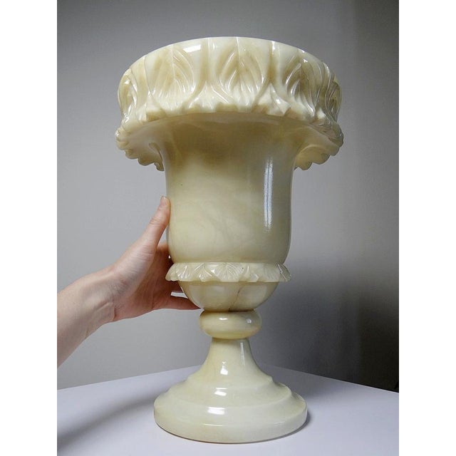 A very beautiful, large, and massive alabaster/yellowish marble vase with translucent veins, hand-carved in the style of a...