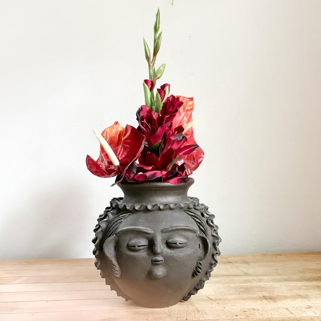 This beautifully sculptural woman face vase from acclaimed Paraguayan Ceramicist Rosa Brítez is every bit as charming as...