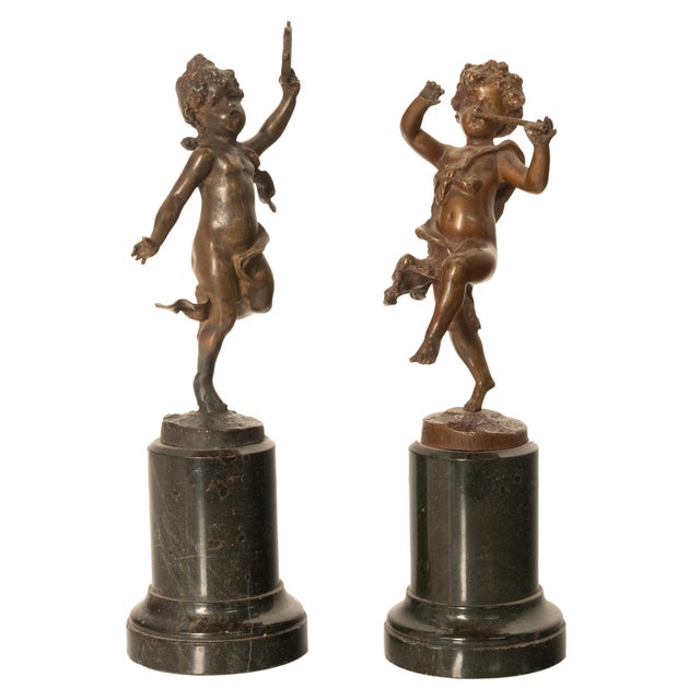 A fine pair of 19th century antique French bronze cherub statues/sculptures on marble plinths, circa 1860. Each sculpture...