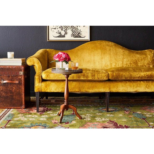 Dramatic citron yellow velvet curvaceous camel back sofa settee made in the Chinese Chippendale taste. Features a shapely...