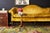 Dramatic citron yellow velvet curvaceous camel back sofa settee made in the Chinese Chippendale taste. Features a shapely...