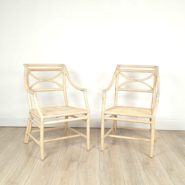 A pair of vintage McGuire armchairs, circa 1980. Seat height 20.75". Two pairs available.