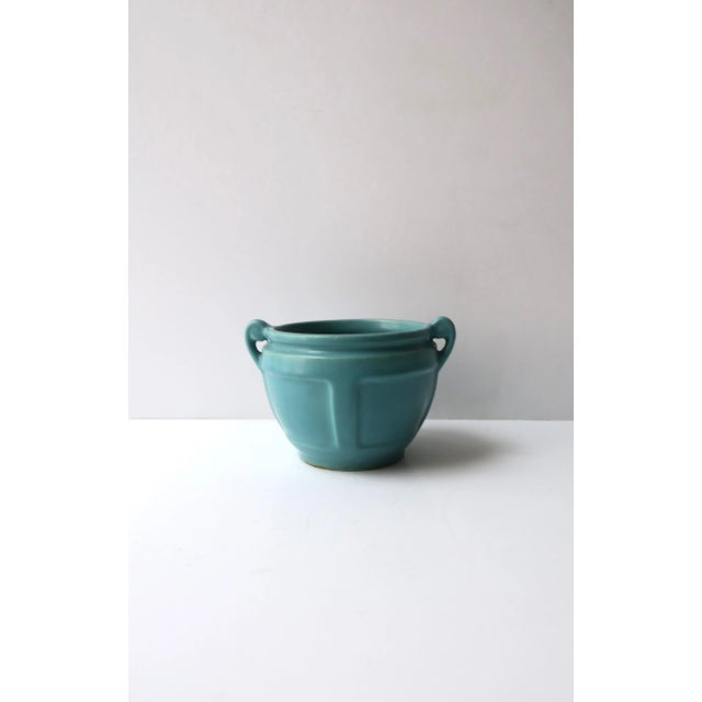 A turquoise urn-style pottery flower or plant pot planter cachepot jardinière, circa early-20th century. A beautiful small...
