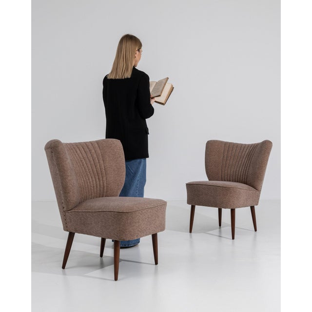 Here is a pair of slipper chairs, its mauve/dusty rose upholstery, tapered legs the first thing to catch the eye....