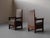 Striking pair of solid oak armchairs characteristic of the architectural style of the Amsterdam School in the 1930s. Their...