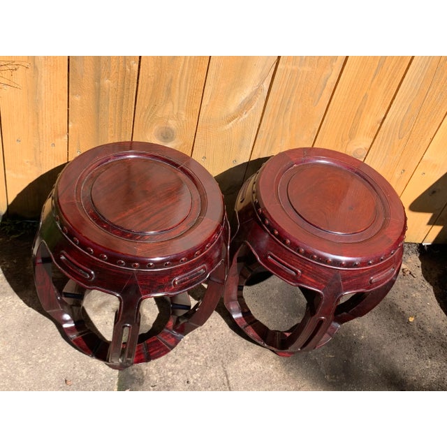 Beautiful pair of vintage garden stools. Made of solid rosewood. Exquisite details and carving. Wonderful red color in the...