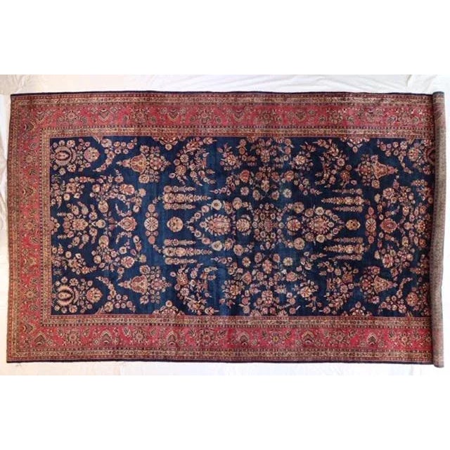 This master piece is a wool pile genuine hand made very fine antique Persian Sarouk Mohajeran carpet- Woven and Signed by...