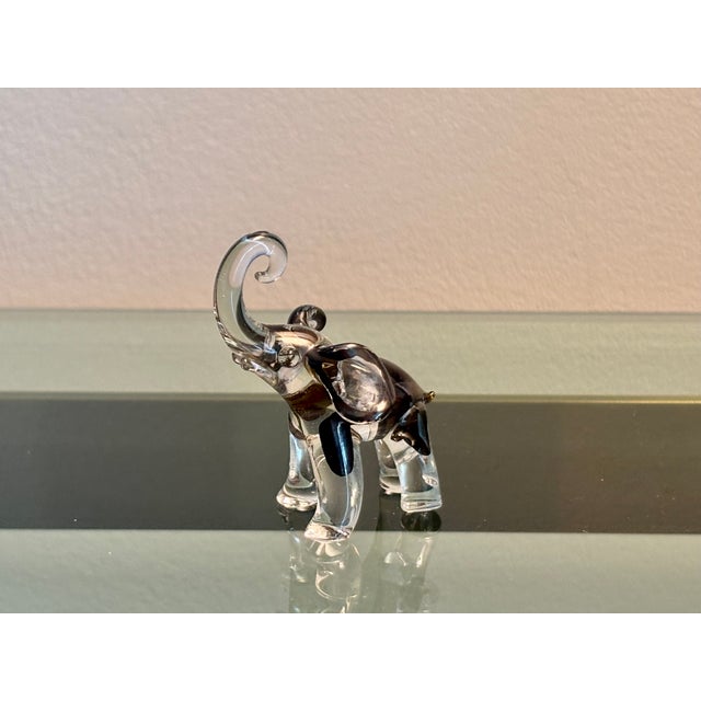Sweet little vintage glass elephant with no issues Measures 1.75" x 1.25" x 2.25" high