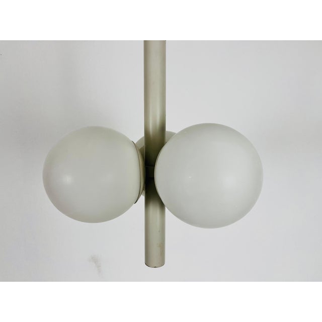 A mid-century Kaiser chandelier made in Germany in the 1960s. It is fascinating with its Space Age design and three...