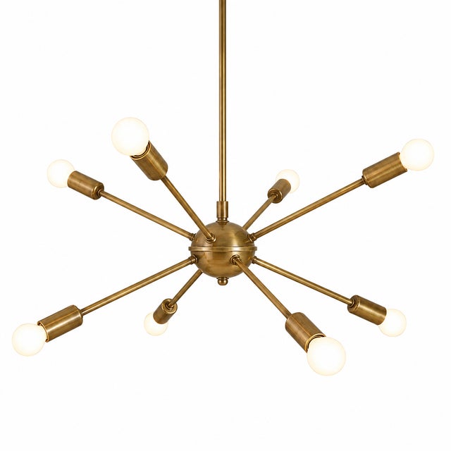 Bring timeless mid-century style into your home with this handmade 8-arm brass Sputnik chandelier. Designed with a...