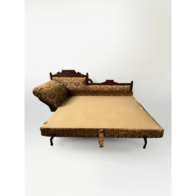 Incredible and rare Victorian pull-out sleeper fainting chaise. Minor scuffs with the most damage to front left corner as...