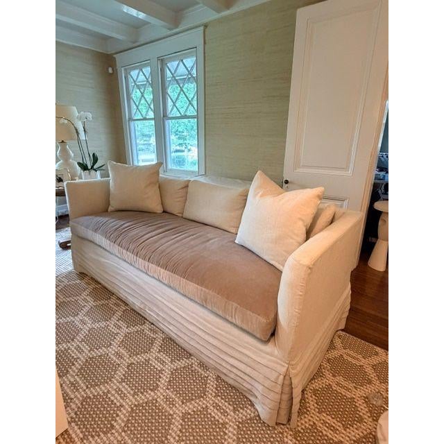 Designed to perfection, this private label sofa features a tan velvet body and a bench seat cushion in darker taupe...